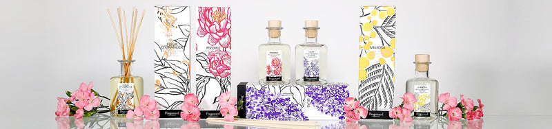 Fragonard perfume bottles arranged with roses and jasmine – French fragrance brand