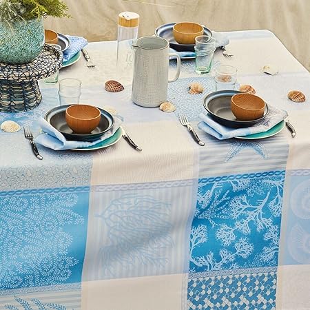 Garnier-Thiébaut Mille Oceans Ecume jacquard tablecloth blue white 69x98 on coastal outdoor table