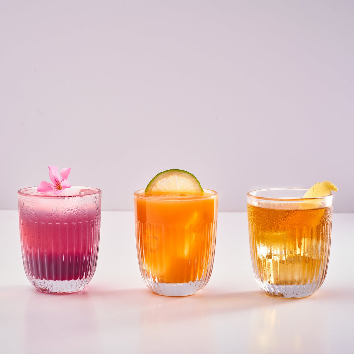Set of six La Rochère Ouessant rose tumblers styled on table