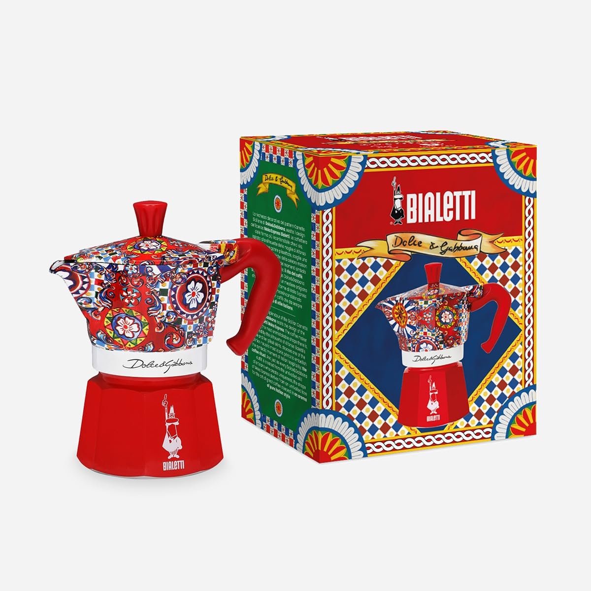 Close-up of Bialetti Dolce Gabbana Moka Express showing Sicilian Cart decorative motifs and Dolce Gabbana signature
