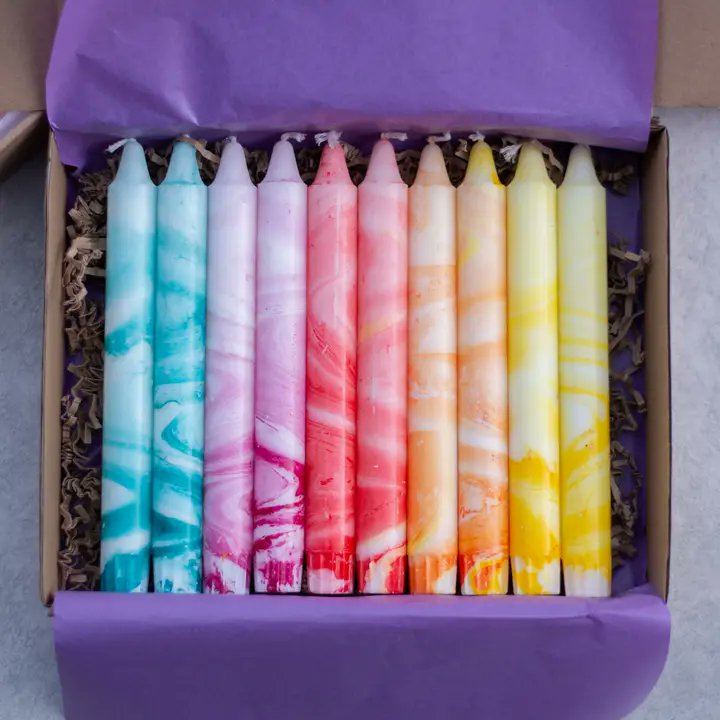 Based on what's visible in the Faire listing, here are 5 alt tag options for the marble mix product images:

Nordtrice marble taper candles 10-pack in gift box with tissue paper