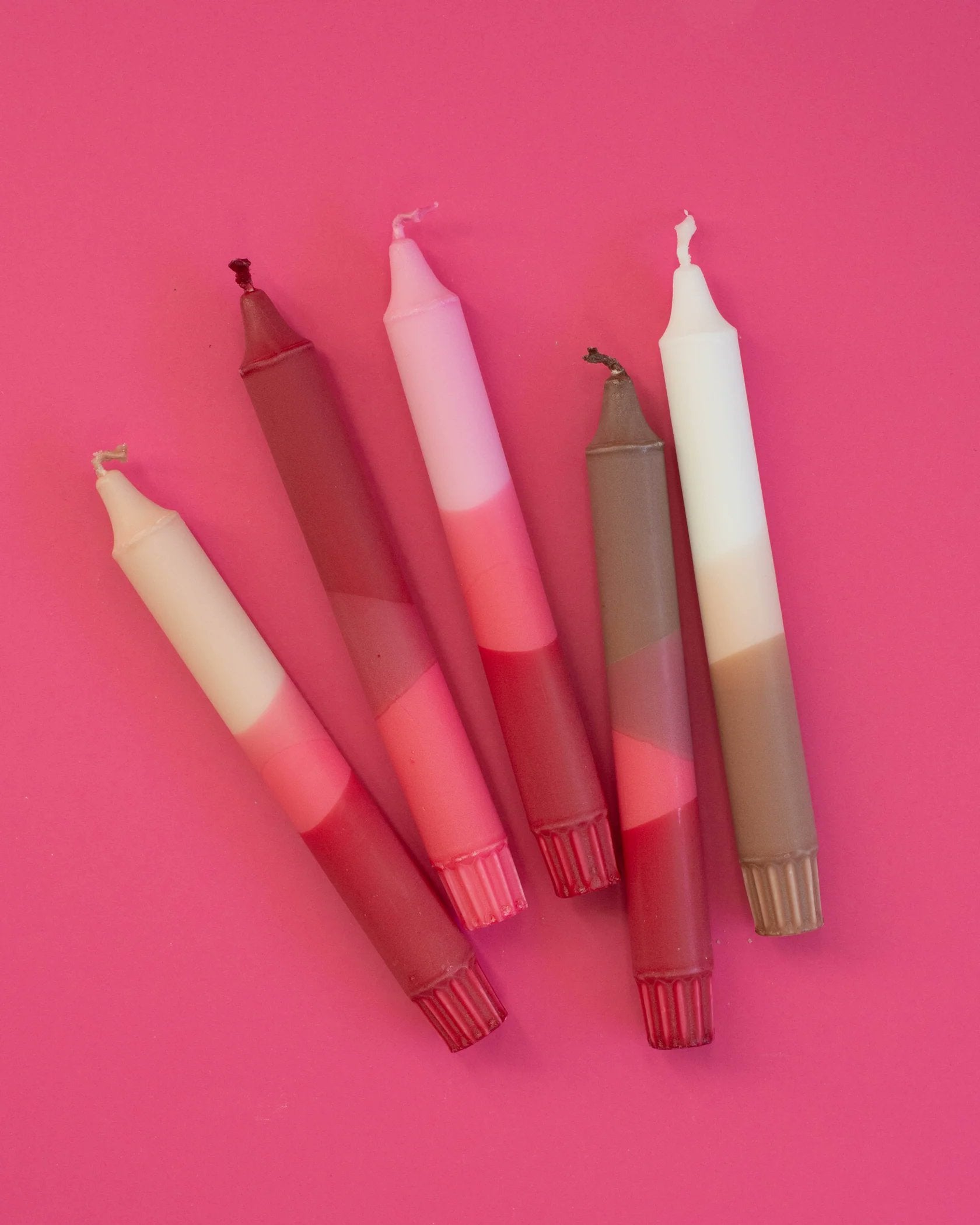 Nordtrice pink taper candles 5-pack overhead flat lay styled shot