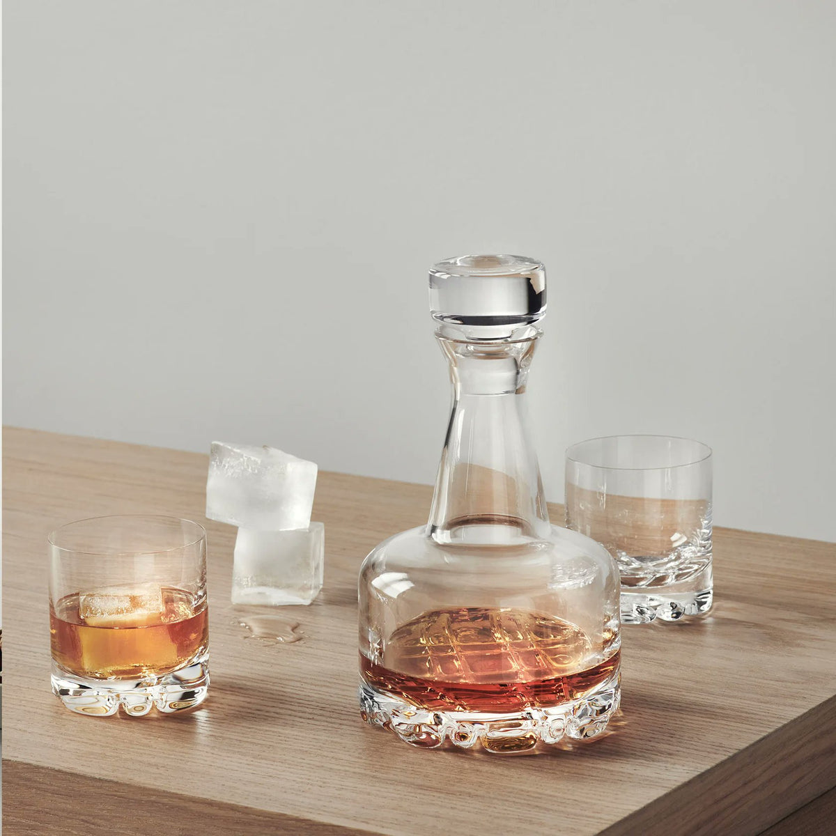 Orrefors Erik Double Old Fashioned Glasses styled with whiskey on bar cart