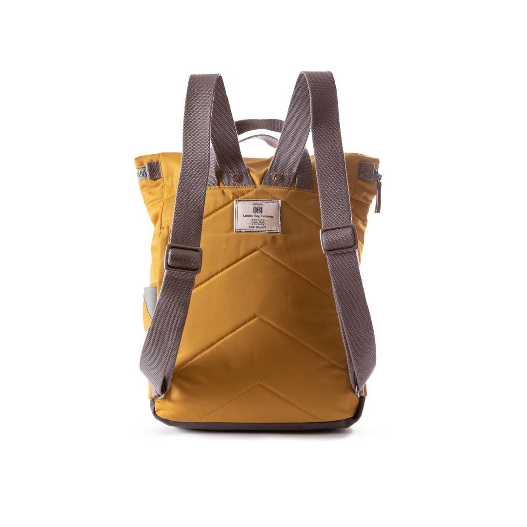 Unisex roll-top backpack for travel and hiking in Corn Yellow nylon