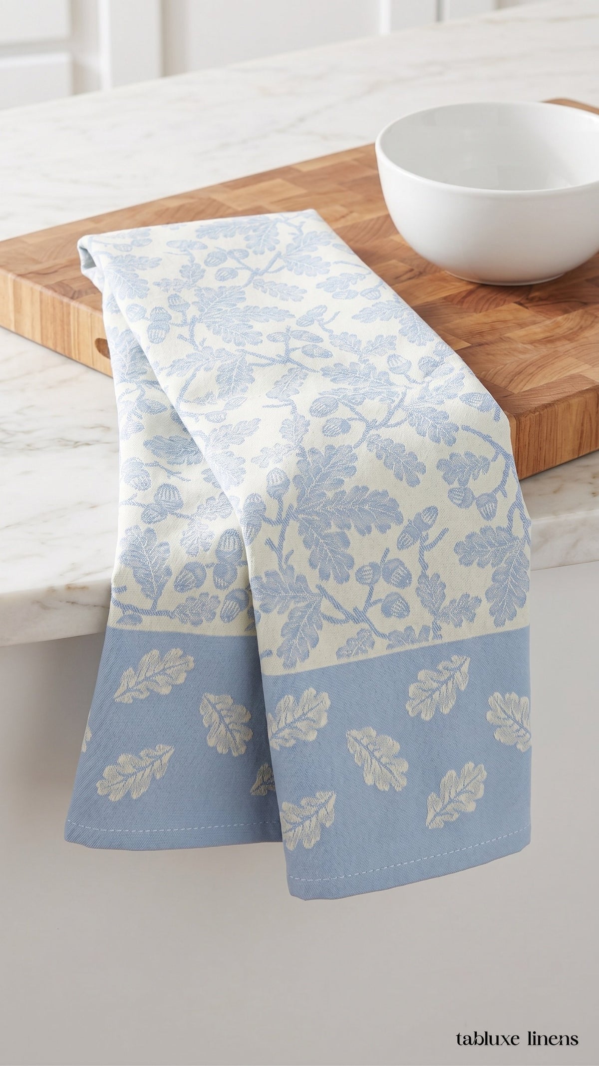 Busatti Rovere Light Blue dish towel draped on marble kitchen counter