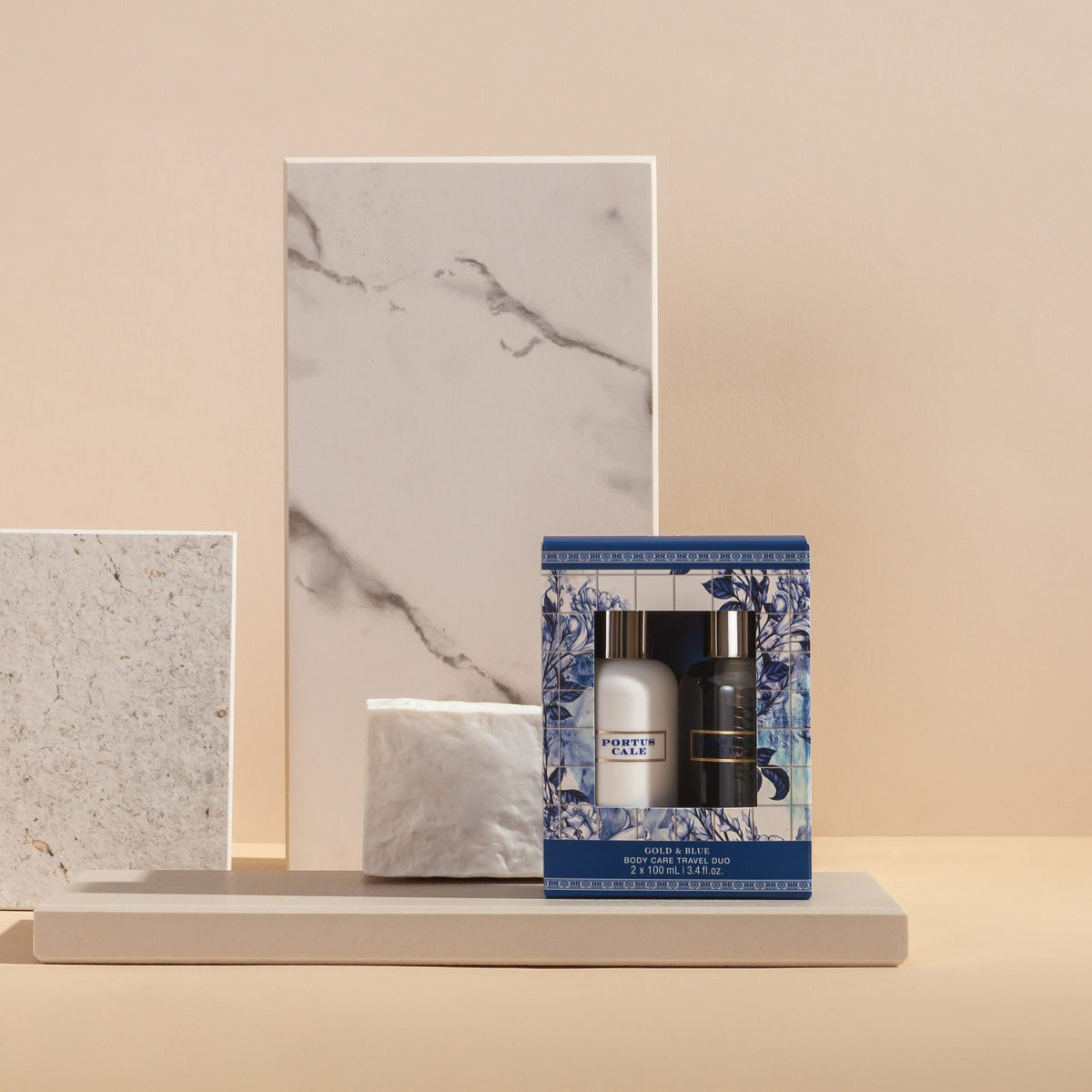 Close-up of Portus Cale Gold & Blue travel-size bottles — 2 × 100 ml