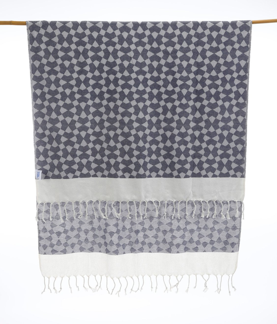 Versatile Turkish towel that doubles as a beach wrap, scarf, or travel essential — stylish and functional