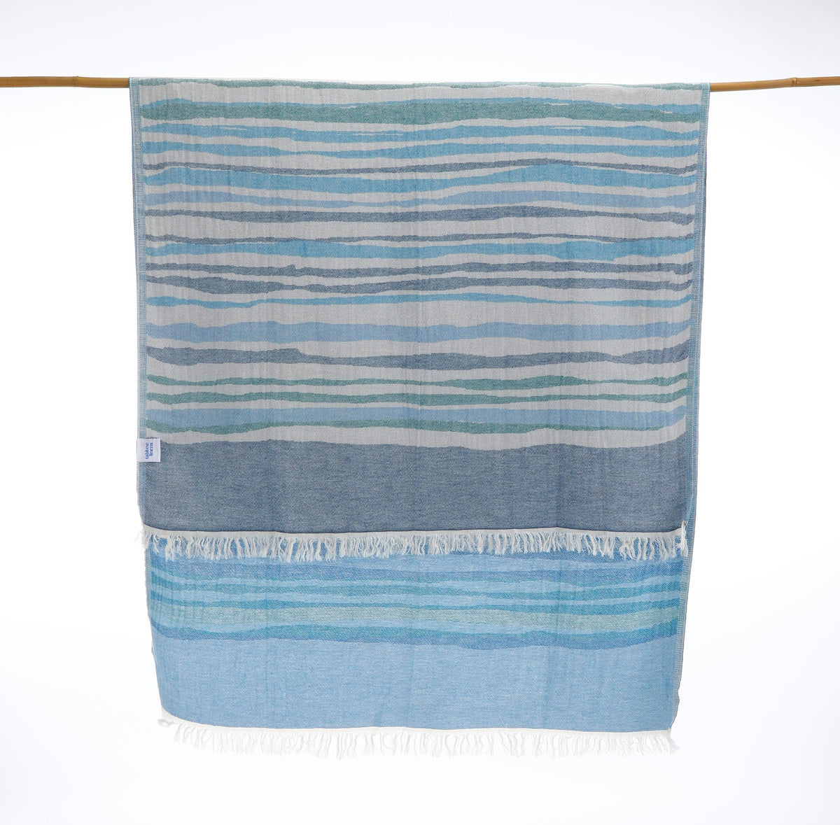 Premium Turkish cotton towel designed for beach, pool, travel, or home — quick-dry and compact