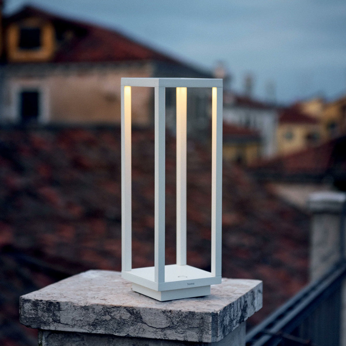 Zafferano Home Pro rust cordless lamp styled on outdoor patio table evening warm glow IP54