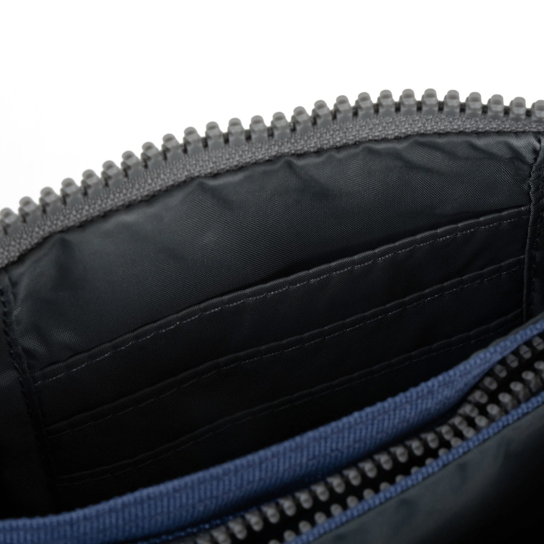 Flat lay of Carnaby small wallet by ORI London in burnt blue color