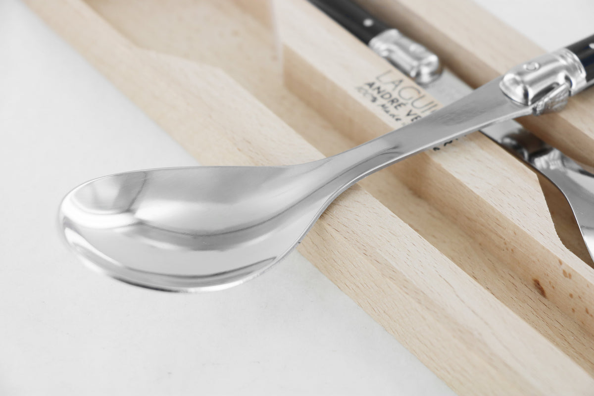 André Verdier Laguiole Debutant cherry red salad server set styled on dining table with salad