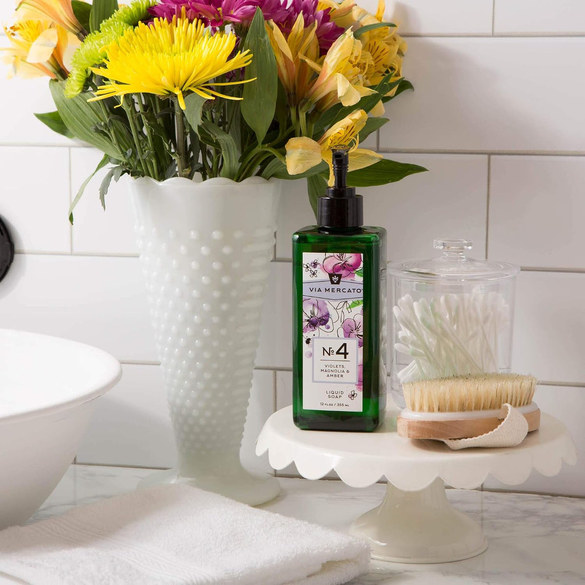 Via Mercato No.4 violet magnolia amber liquid hand soap 12oz styled on bathroom sink countertop