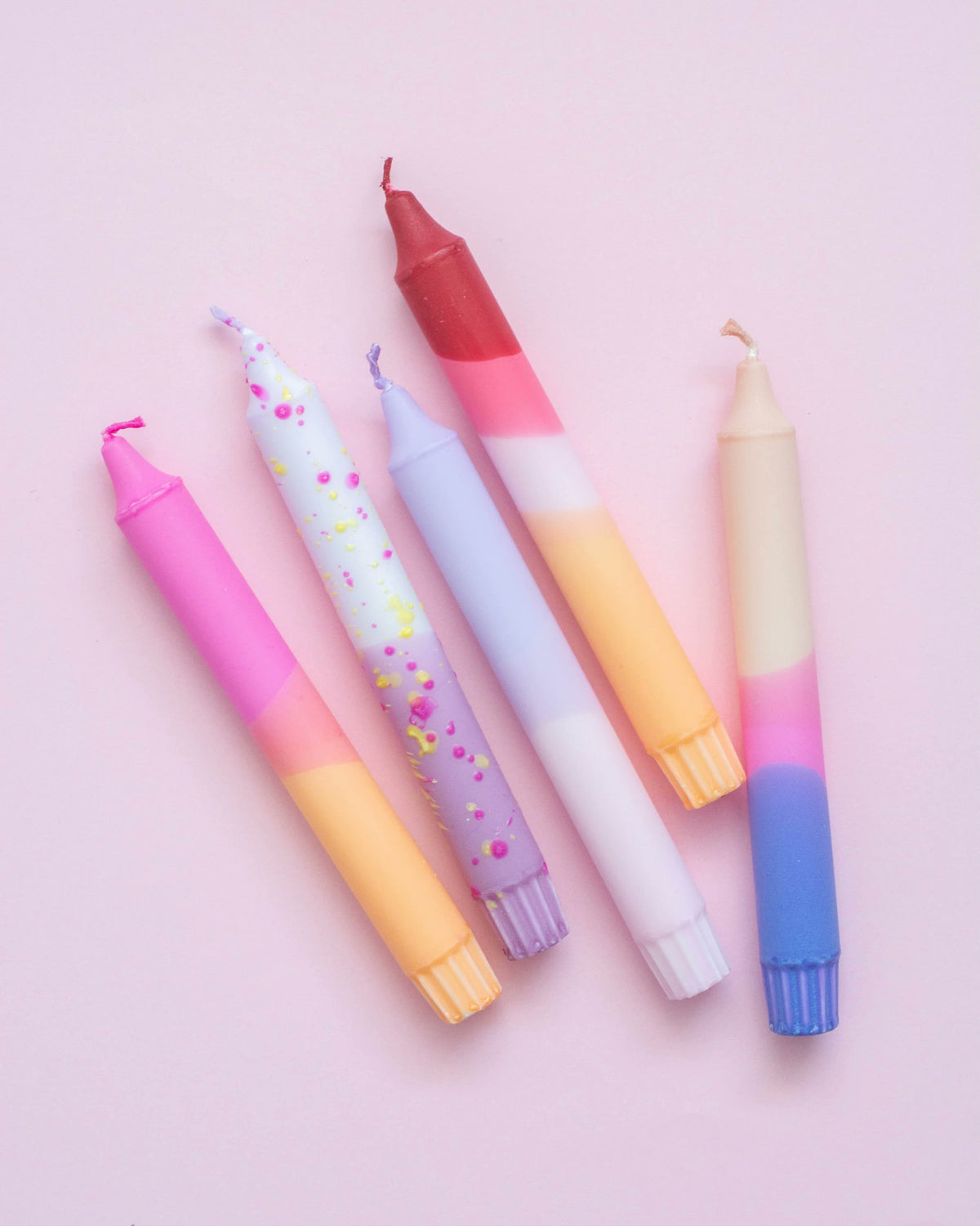 Nordtrice pastel taper candles 5-pack loose arrangement showing full color mix