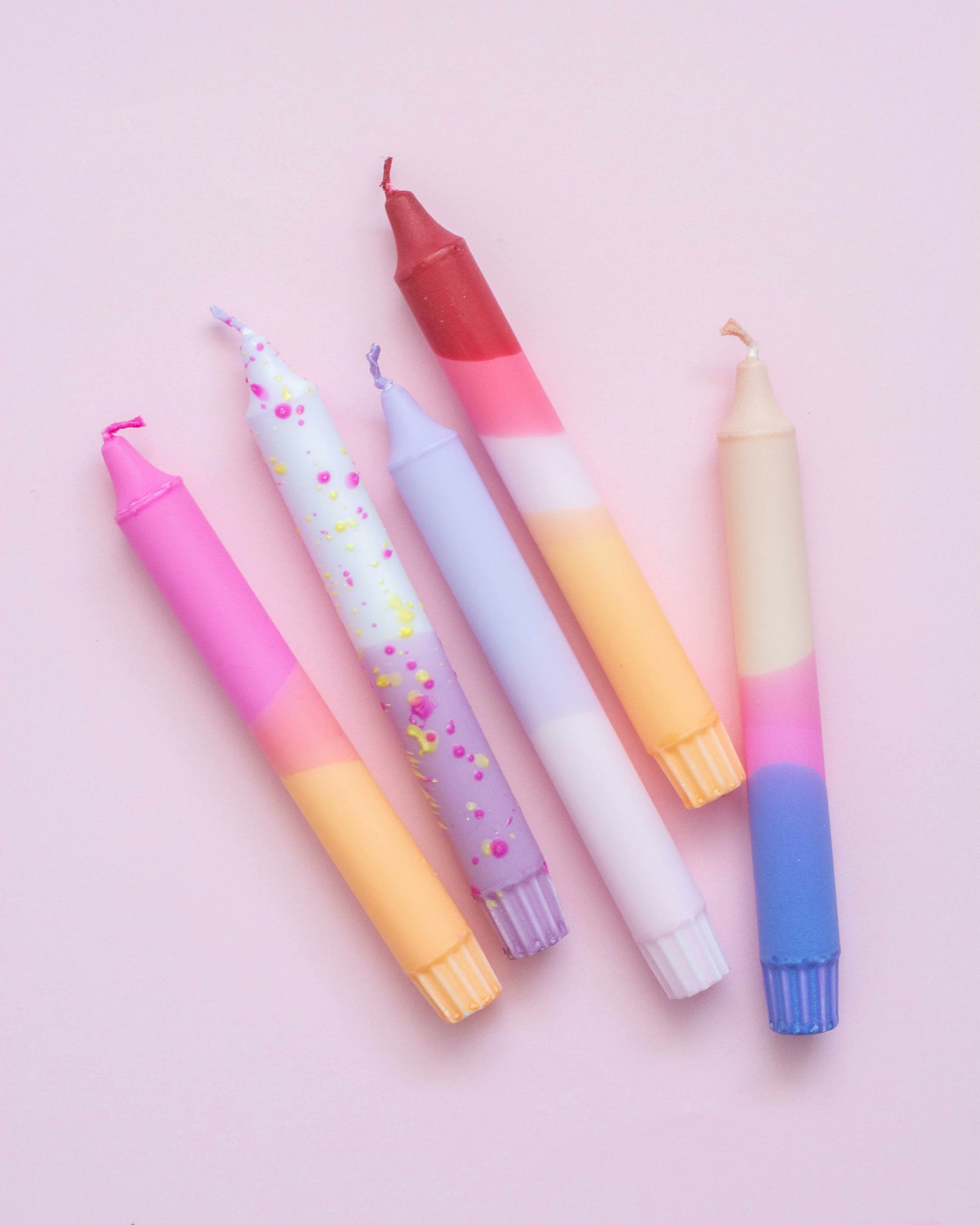 Nordtrice pastel taper candles 5-pack loose arrangement showing full color mix