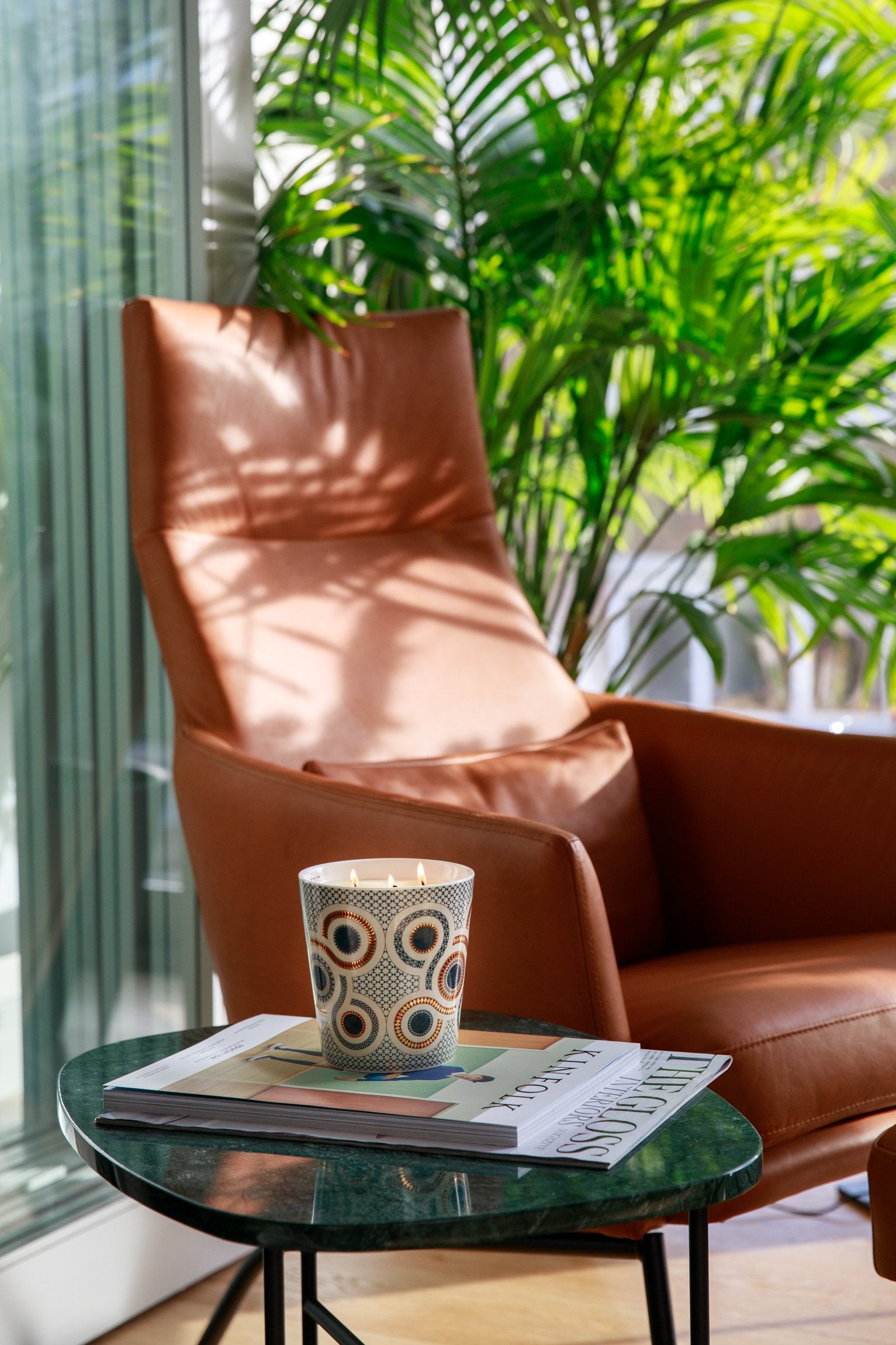 Luxury scented candle with incense, amber, and oak wood notes by Ilum