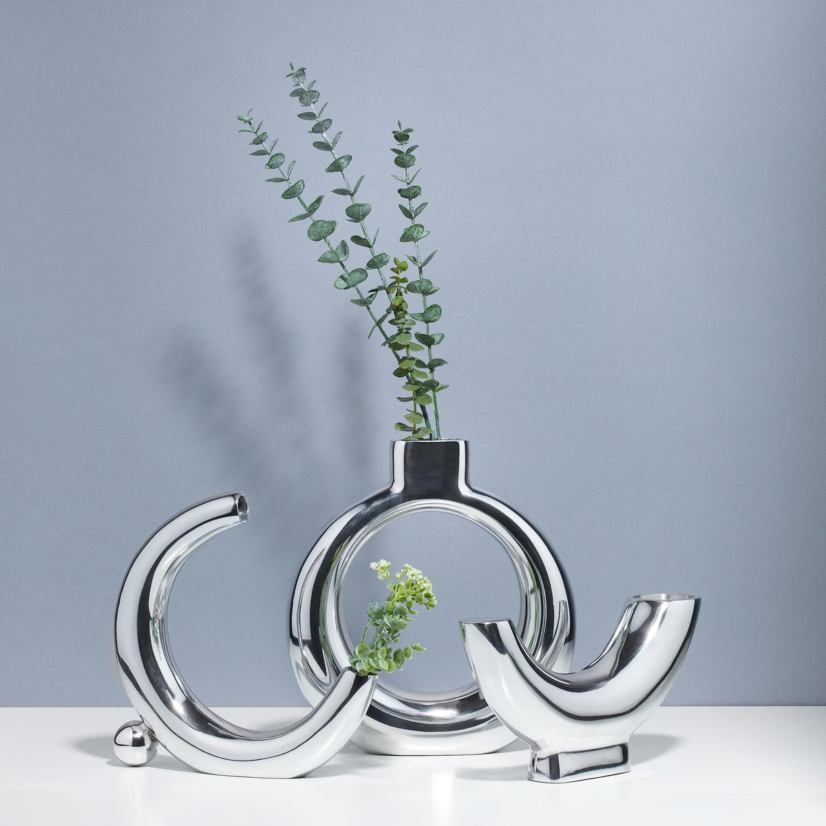 Nambé Solarium Vase paired with Half Moon and Crescent Moon Vases