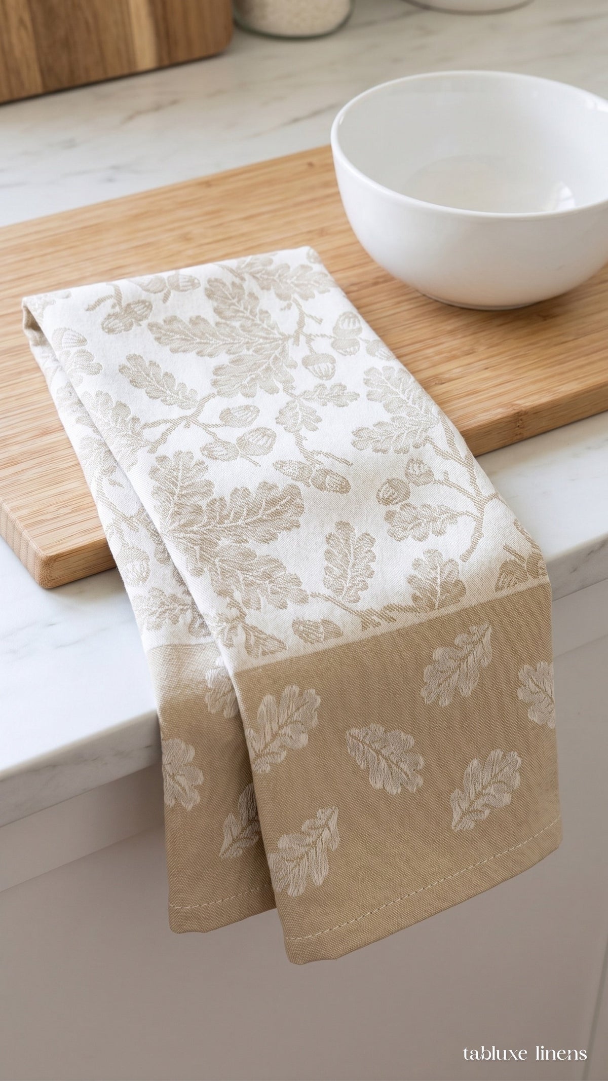 Busatti Rovere Sand dish towel draped on marble kitchen counter