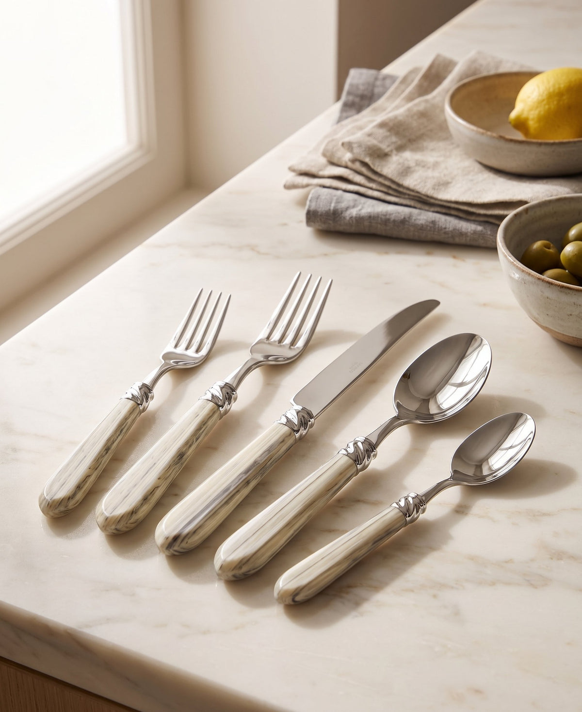 Capdeco Diana Marble Flatware 18/10 Stainless Steel | Cream Marble | 5-Piece Set on kitchen counter