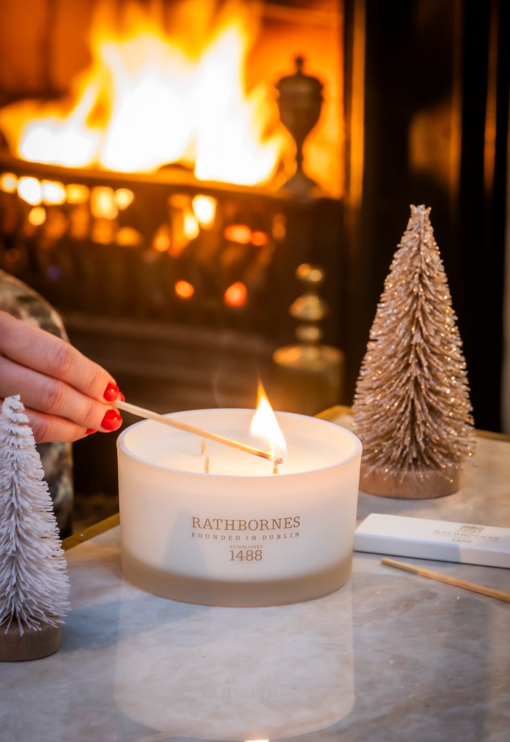 Cedar Cloves and Amber candle in travel and luxury sizes by Rathbornes