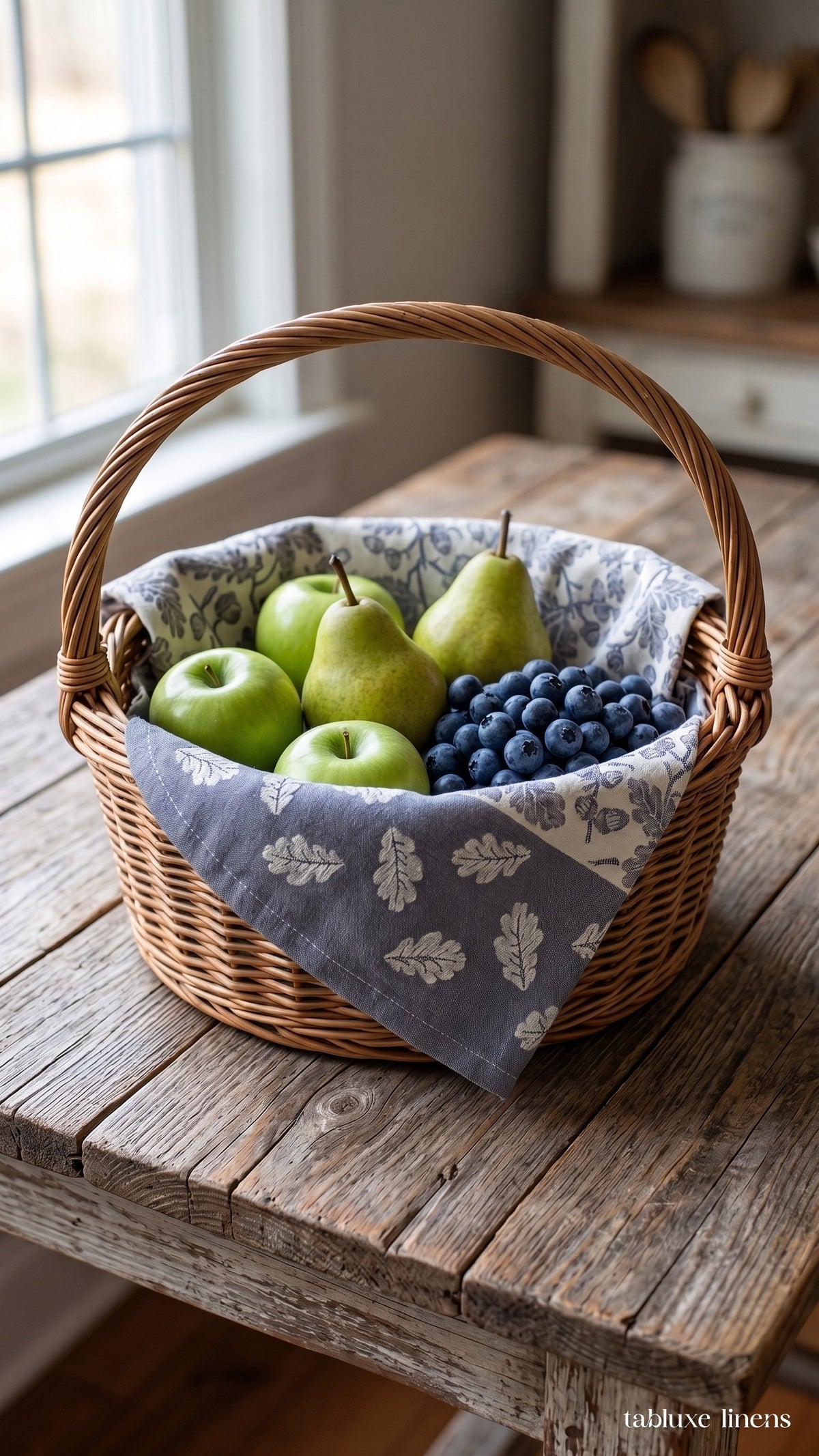 Busatti Rovere Navy kitchen towel lining a wicker fruit basket