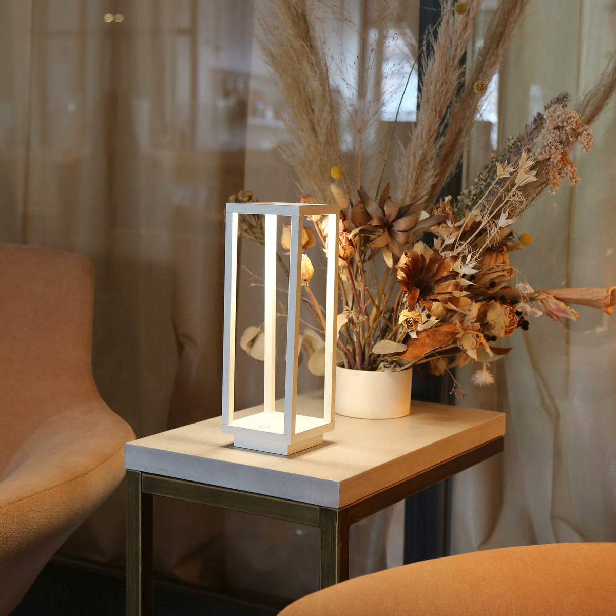 Zafferano Home Pro white cordless lamp styled on desk or side table indoor ambient lighting