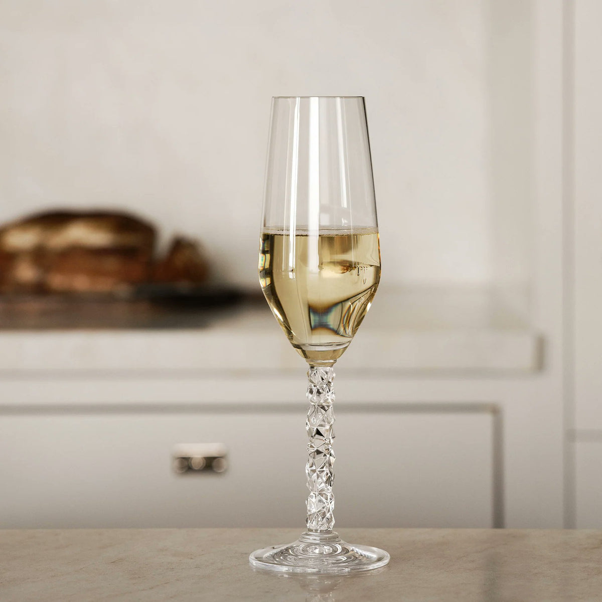 Orrefors Carat Champagne Glasses styled with sparkling wine