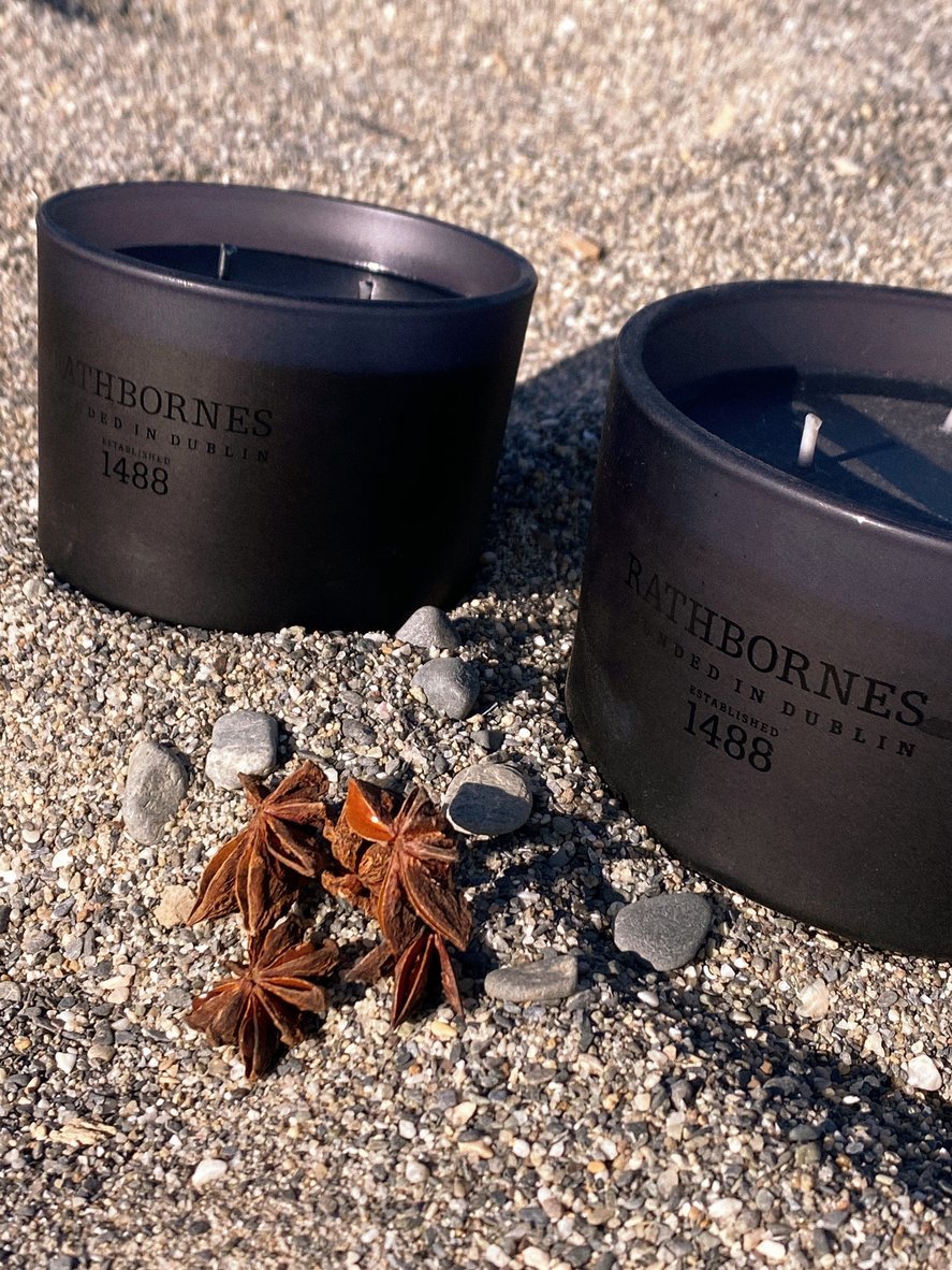 Smoky oud and ozonic Irish scented candle with coastal notes