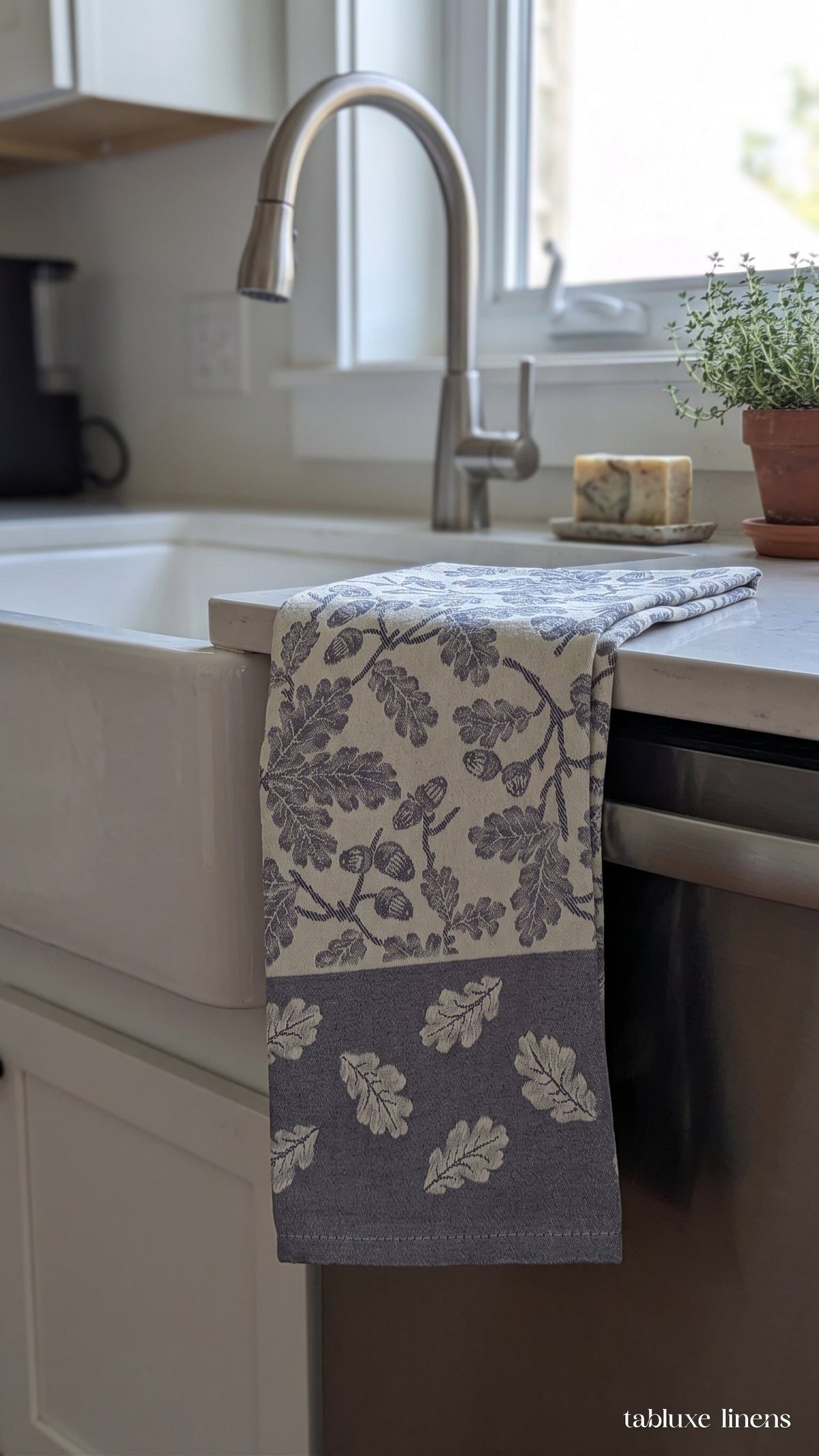 Busatti Rovere Navy dish towel draped on marble kitchen counter