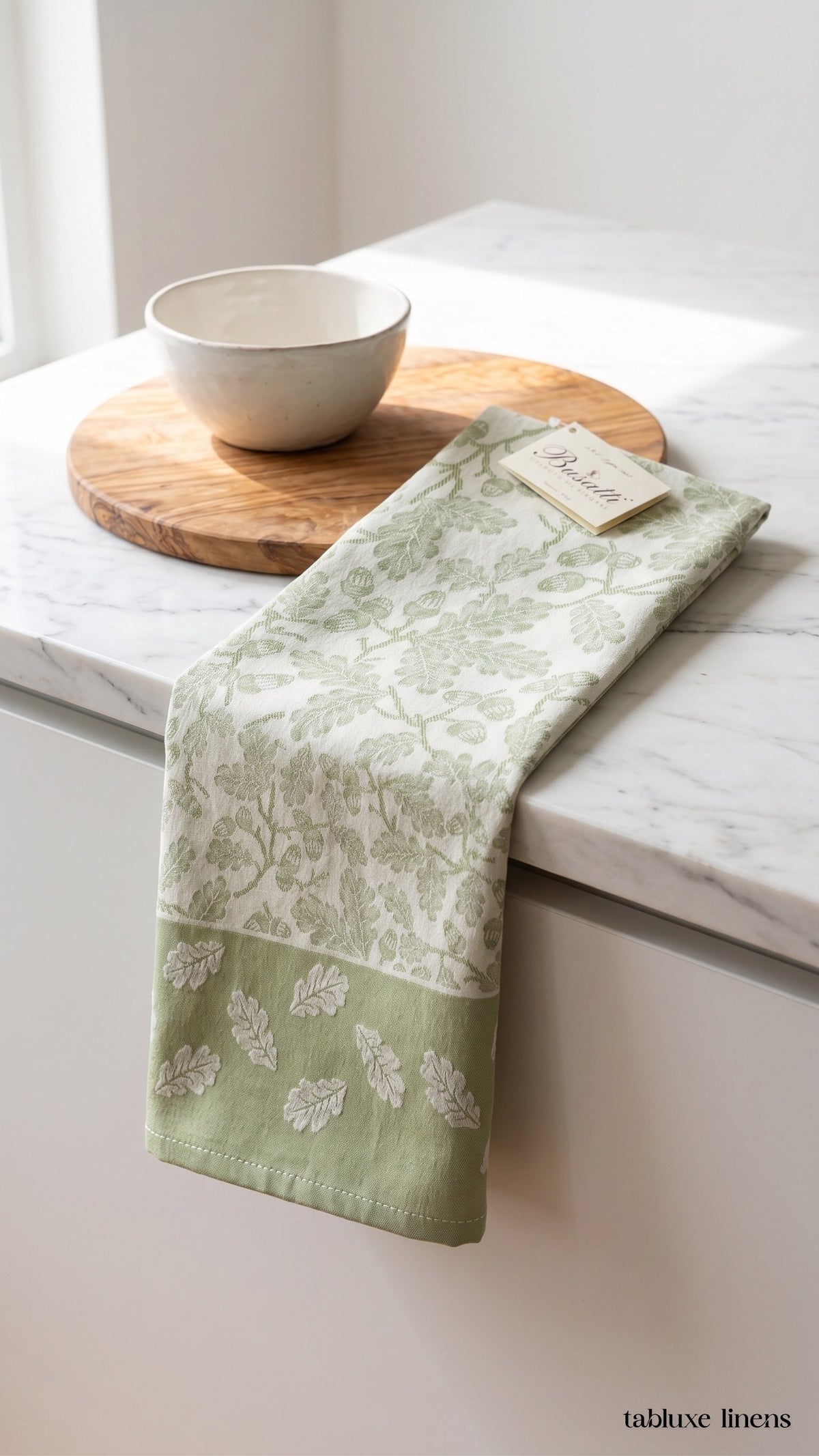 Busatti Rovere Olive Green dish towel draped on marble kitchen counter