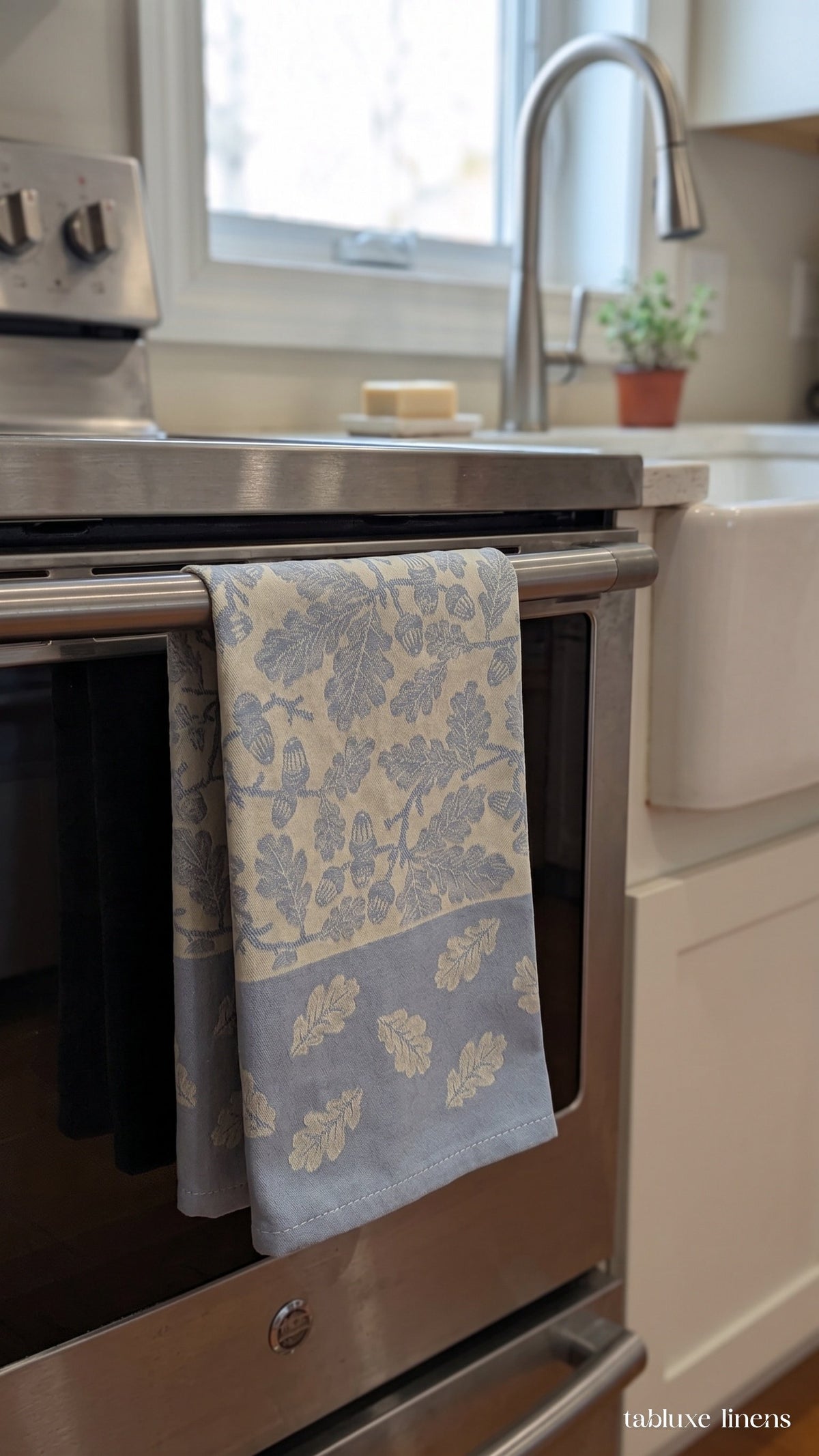 Busatti Rovere Light Blue tea towel hanging on kitchen sink oven handle