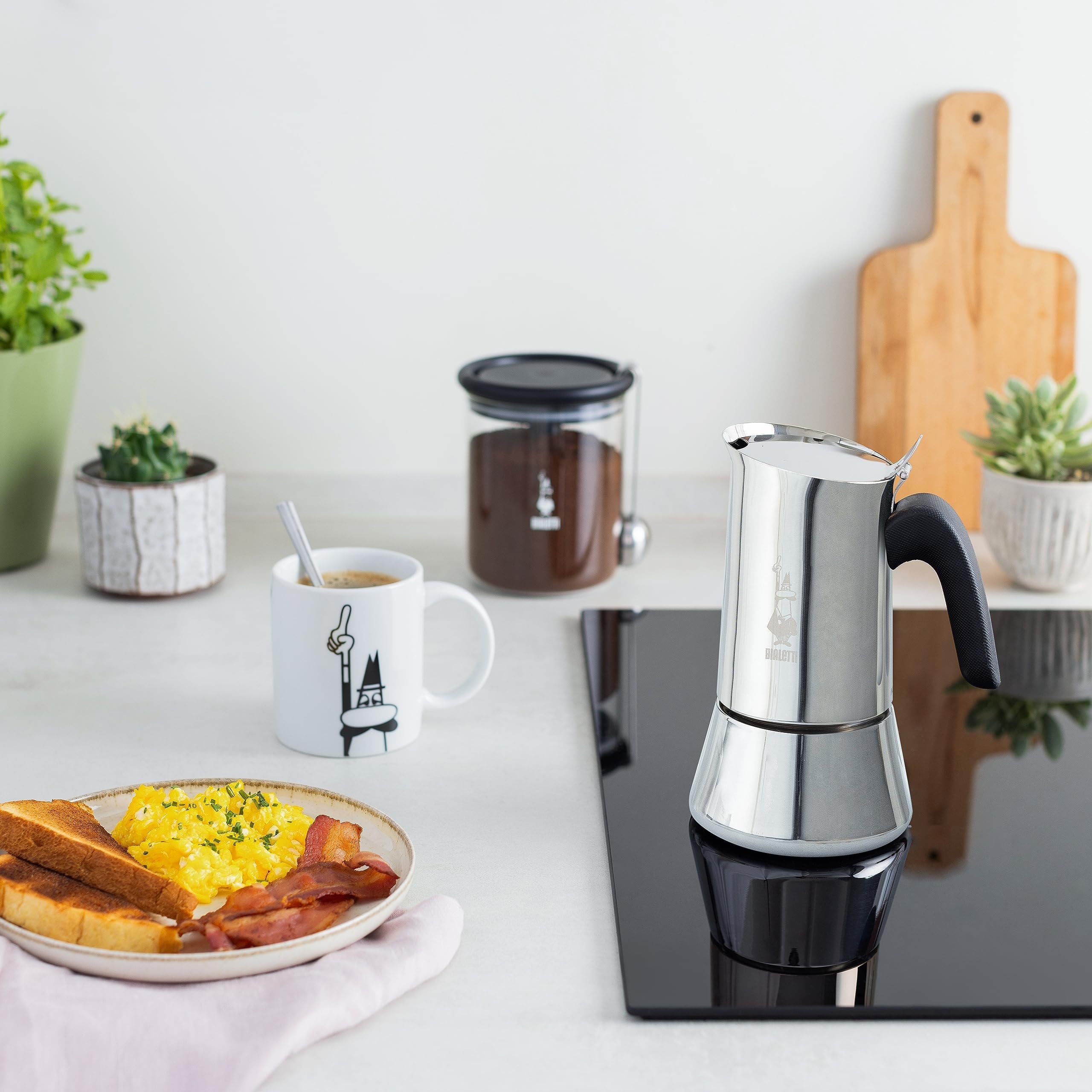 Close-up of Bialetti Venus Induction showing stainless steel finish patented safety valve and elegant design