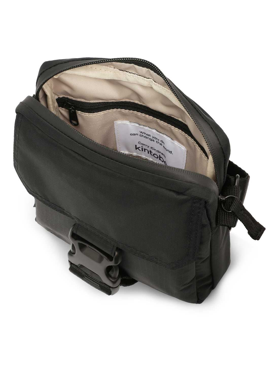 Close-up of Kintobe Nico jet black messenger bag showing flap pocket metal hardware and recycled nylon texture