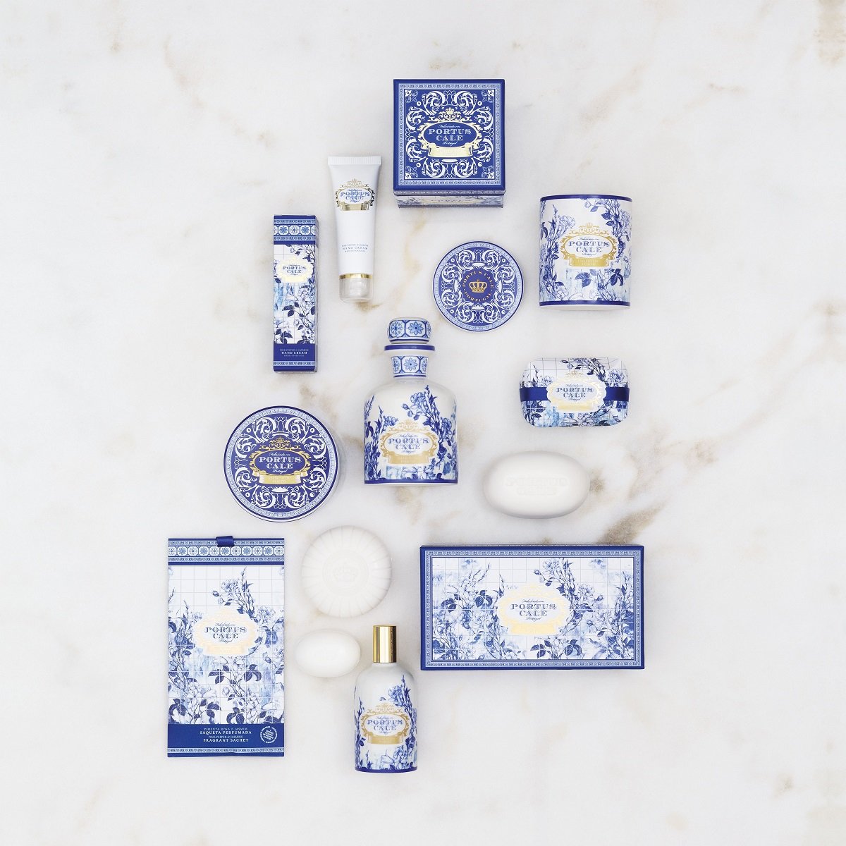 Elegant home décor set in blue and white: Portus Cale Gold & Blue diffuser, candle, and pleated-wrapped soap