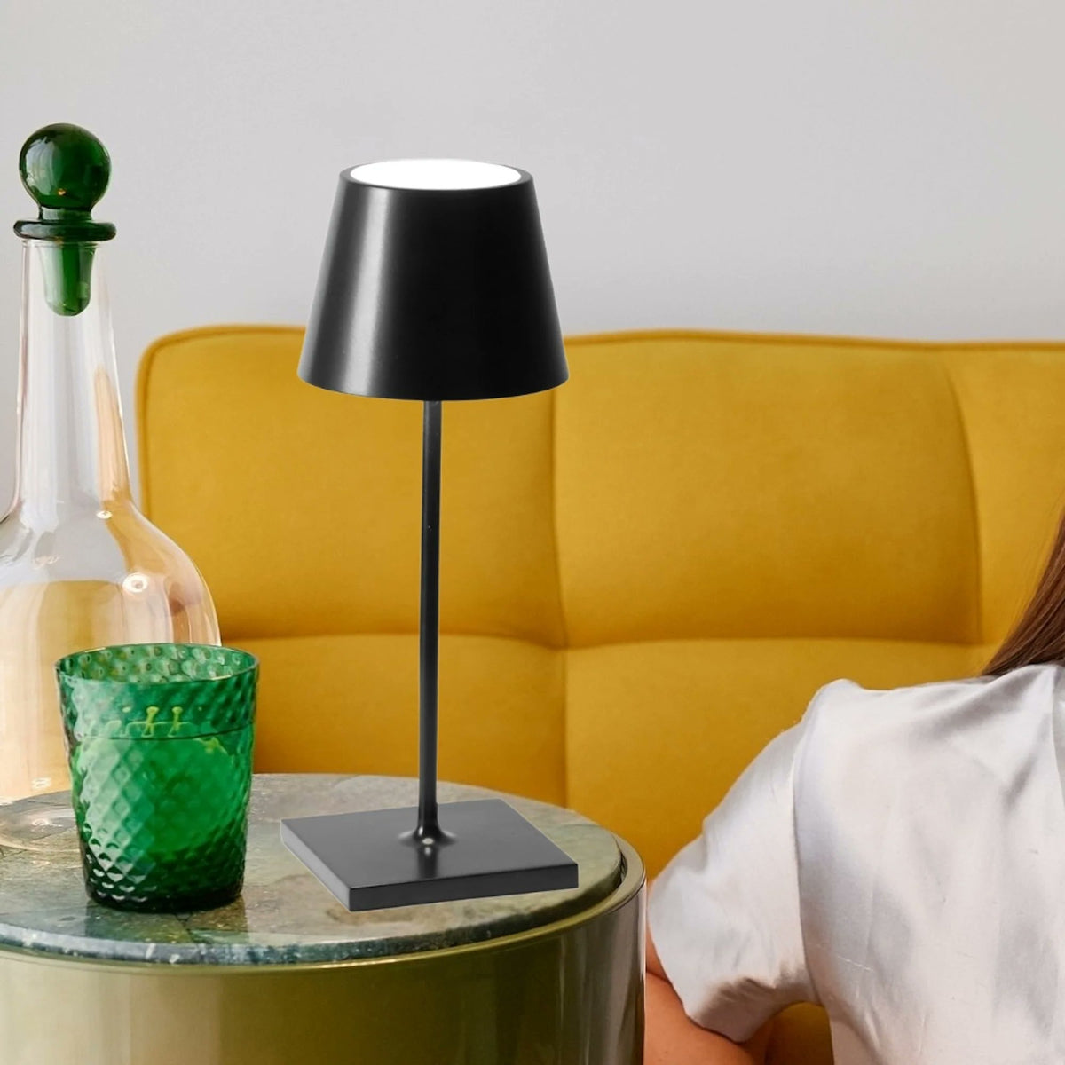 Zafferano Poldina Pro Mini rust cordless lamp styled on warm toned surface indoor ambient
