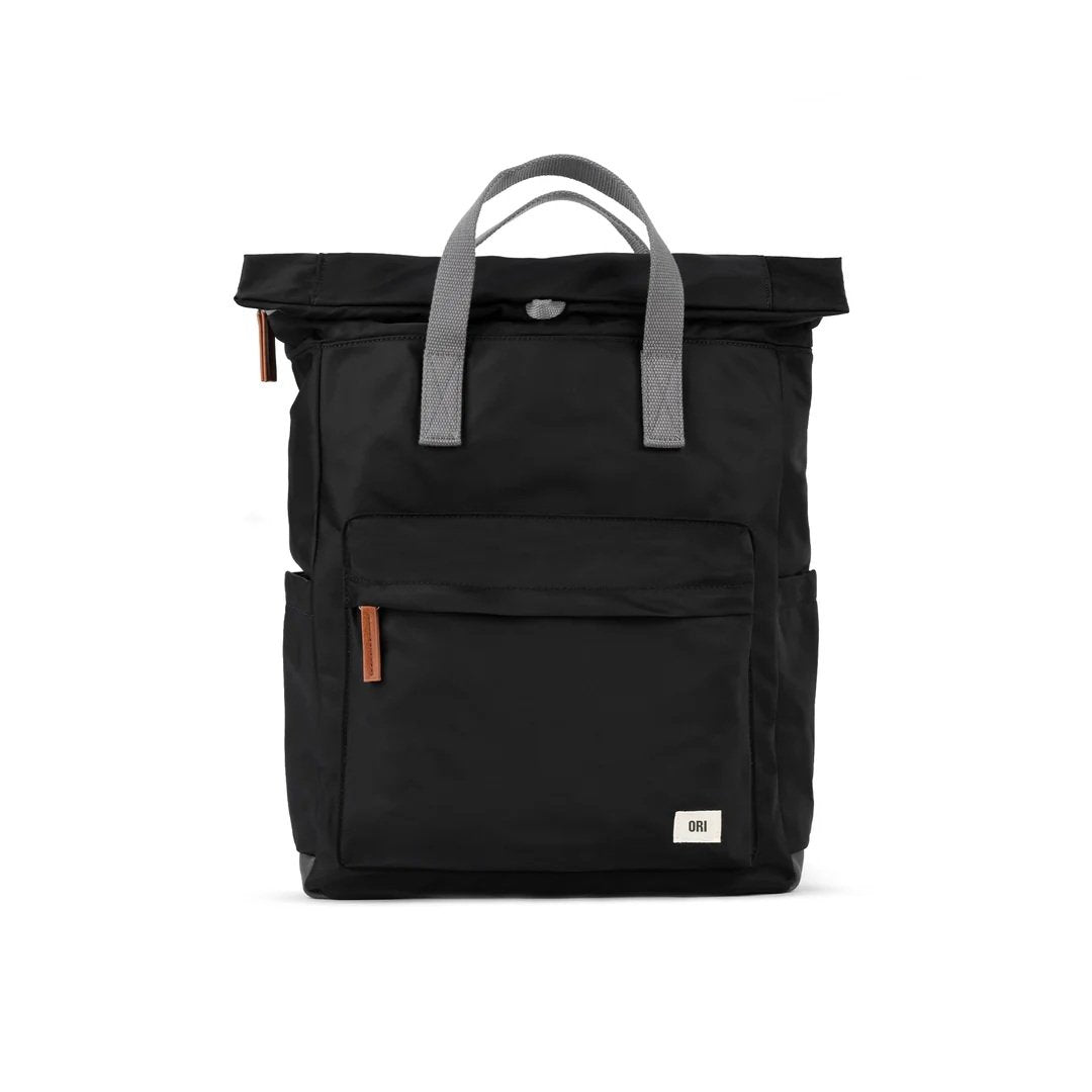 Back view of black ORI London Canfield B showing adjustable cotton straps and loop handle