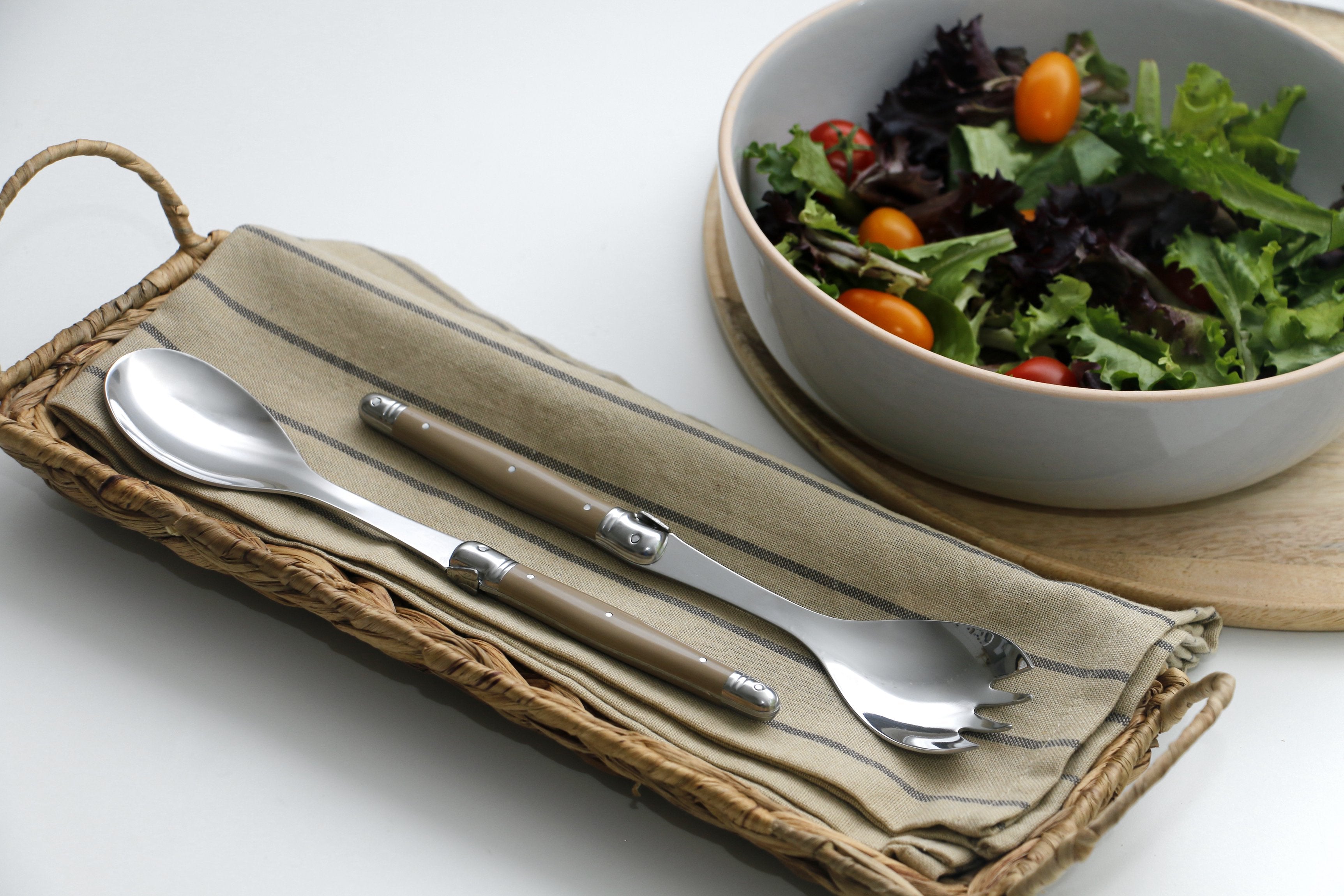 André Verdier Laguiole salad servers close-up sand handle bee emblem André Verdier trademark