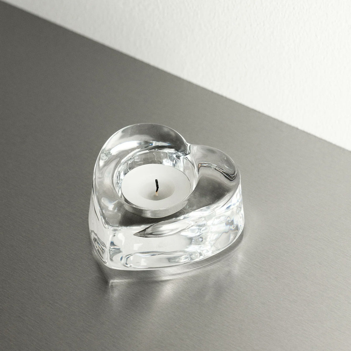 Orrefors My Heart Votive styled on table with lit tealight