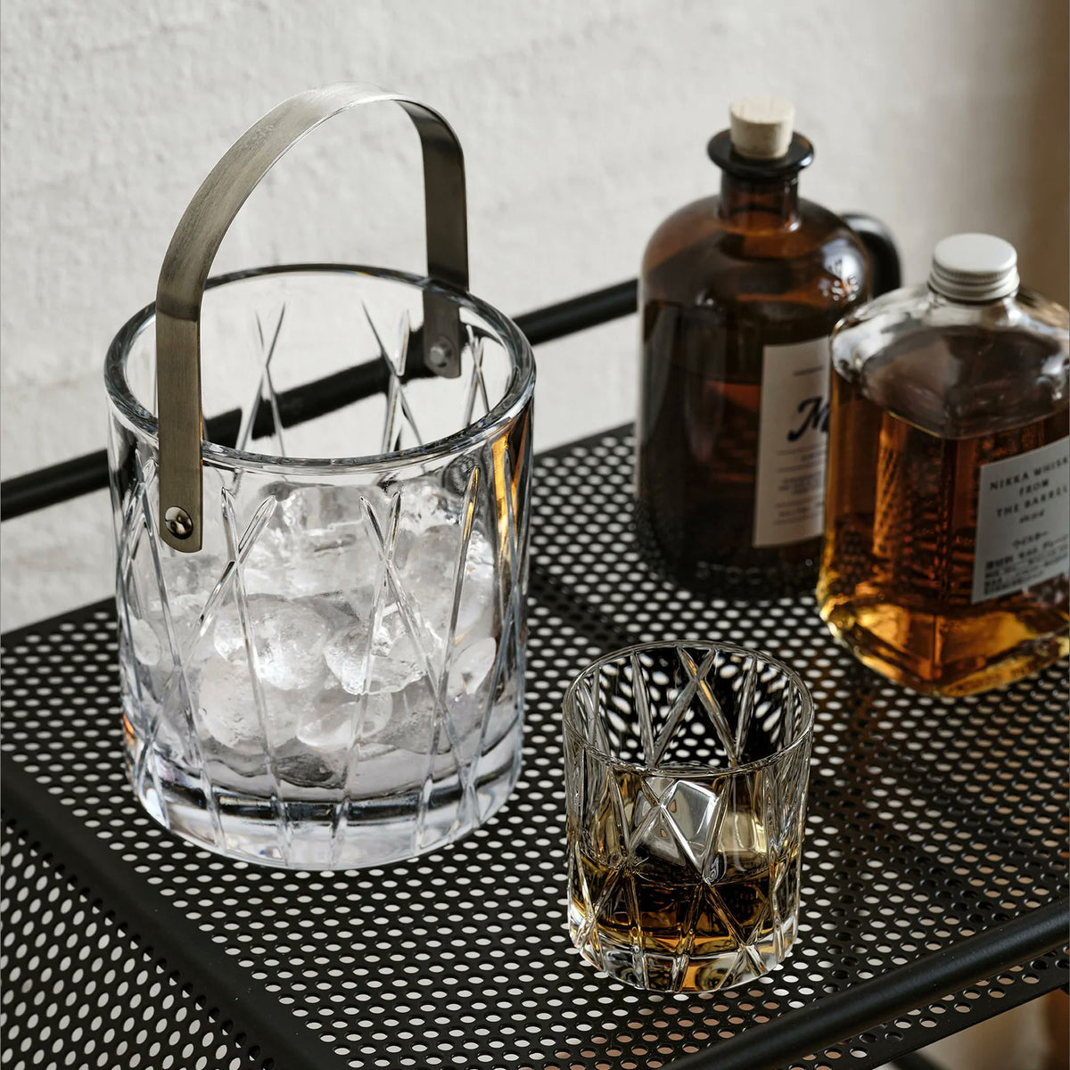 Orrefors City Ice Bucket styled on bar cart with cocktails