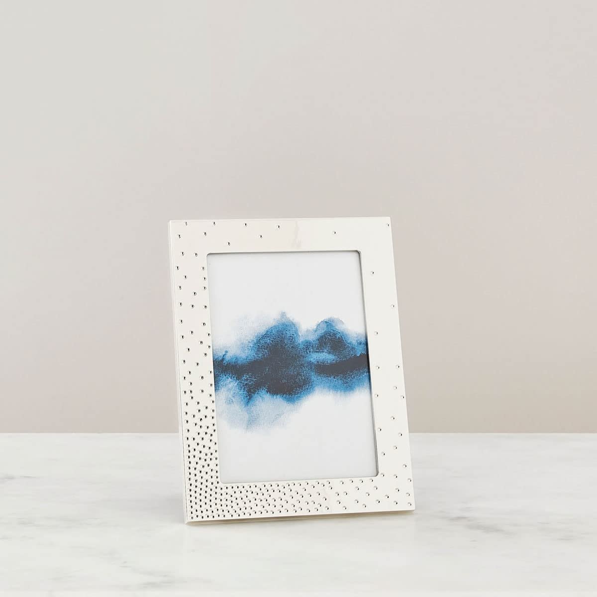 Nambé Dazzle Picture Frame styled on side table with family photo