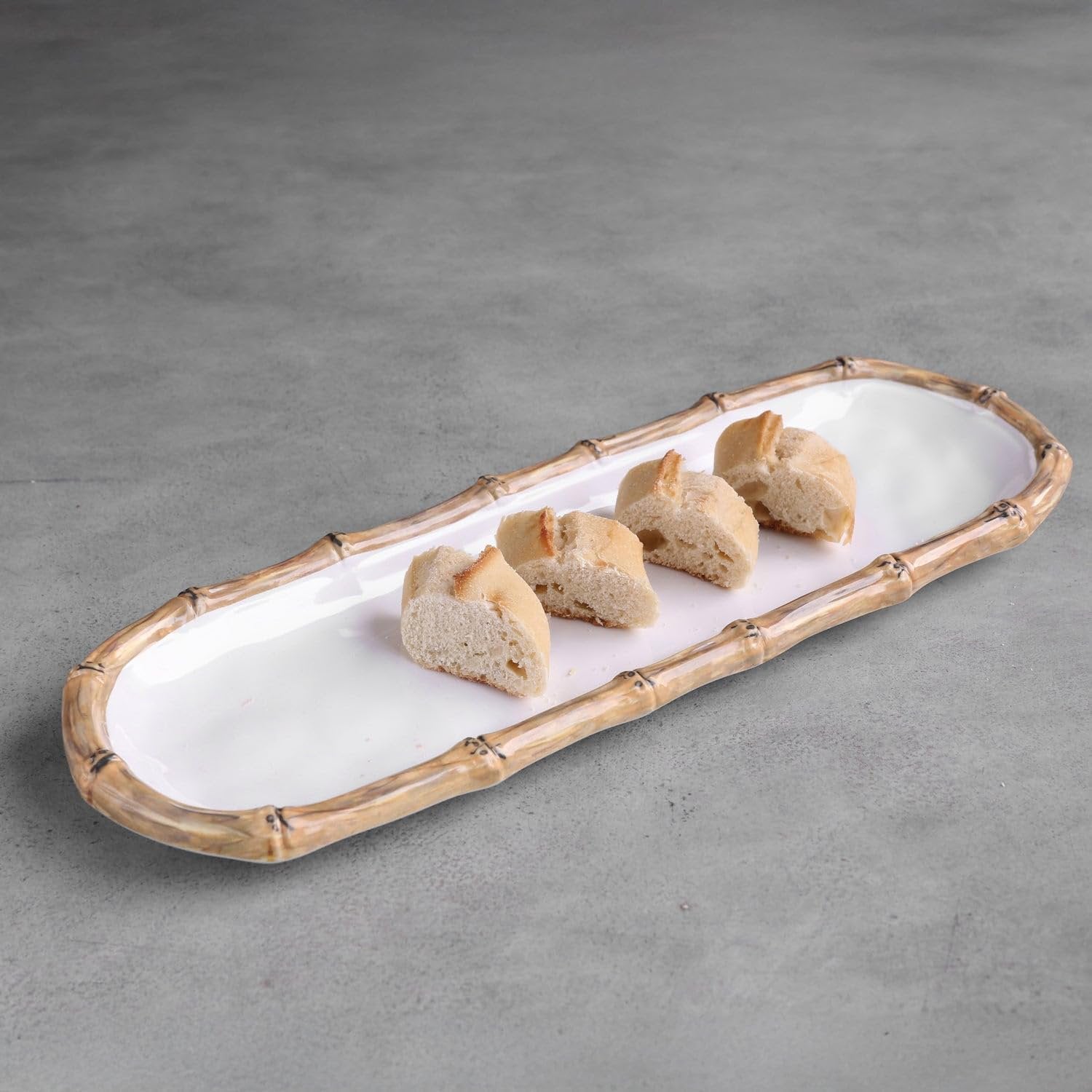 Beatriz Ball VIDA Bamboo baguette platter styled on dining table with charcuterie spread