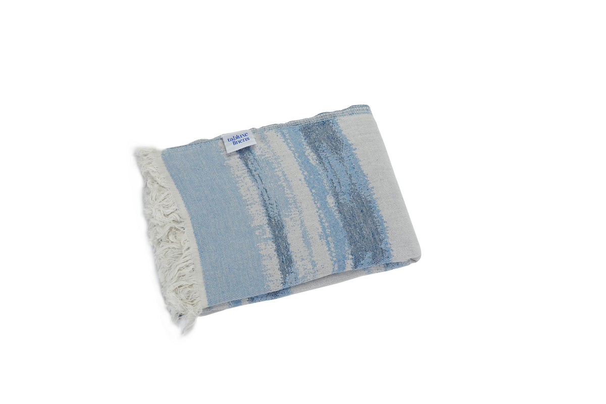 Versatile Turkish towel that doubles as a beach wrap, scarf, or travel essential — stylish and functional