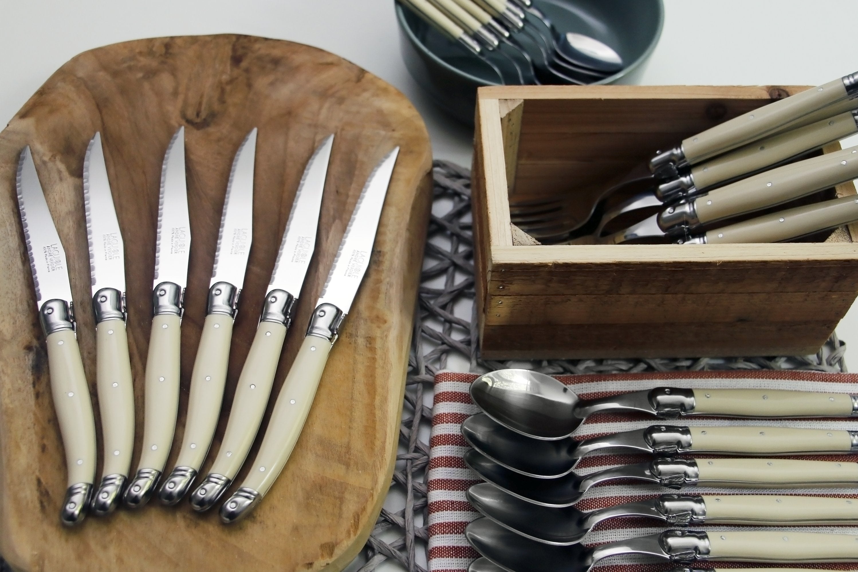 André Verdier Laguiole Debutant 24pc ivory flatware set styled on formal dining table