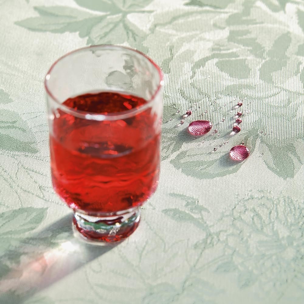 Garnier-Thiébaut Jardin de Pivoines jacquard tablecloth close-up peony bird dragonfly pattern green