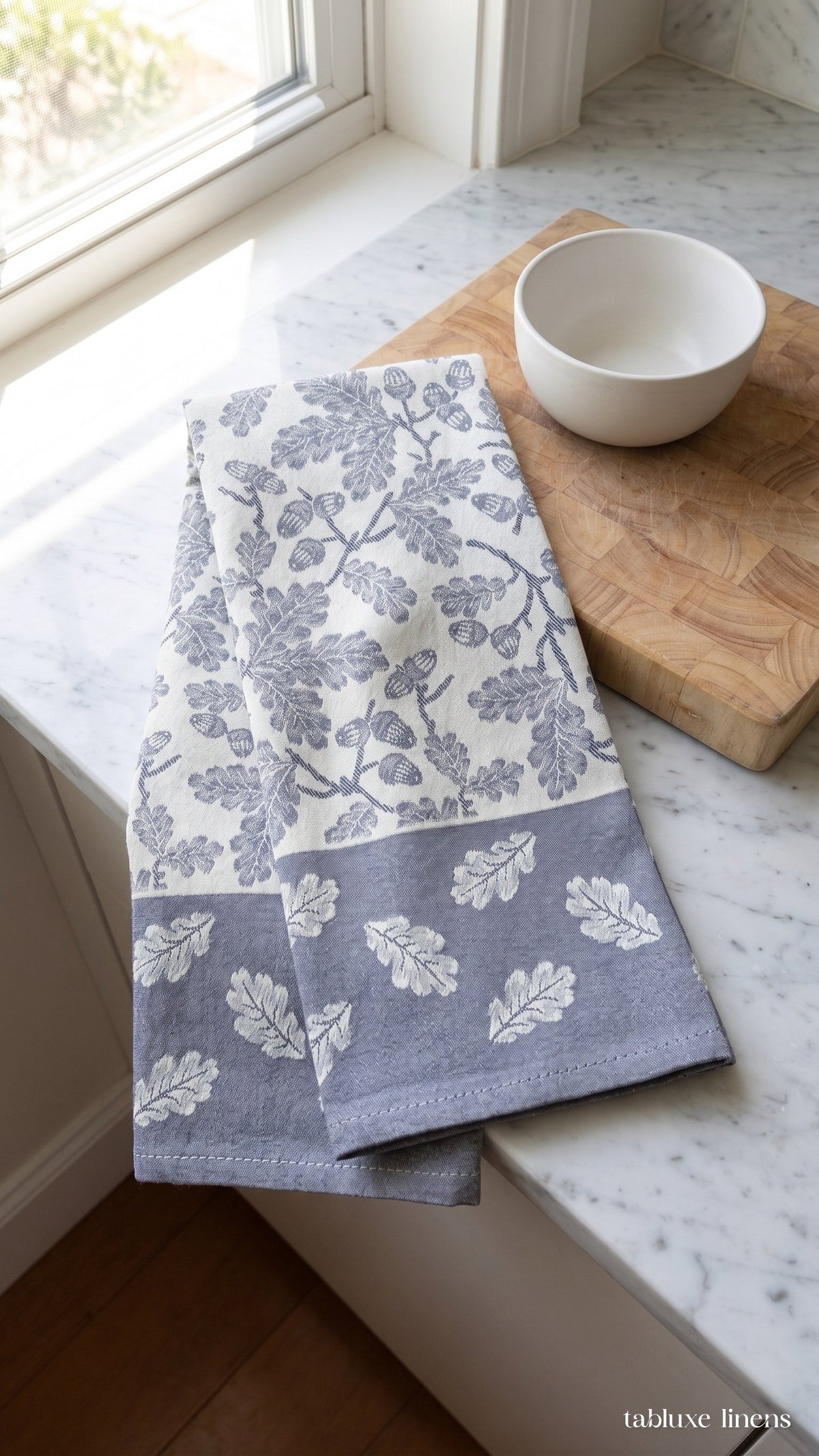 Busatti Rovere Navy tea towel hanging on kitchen sink oven handle
