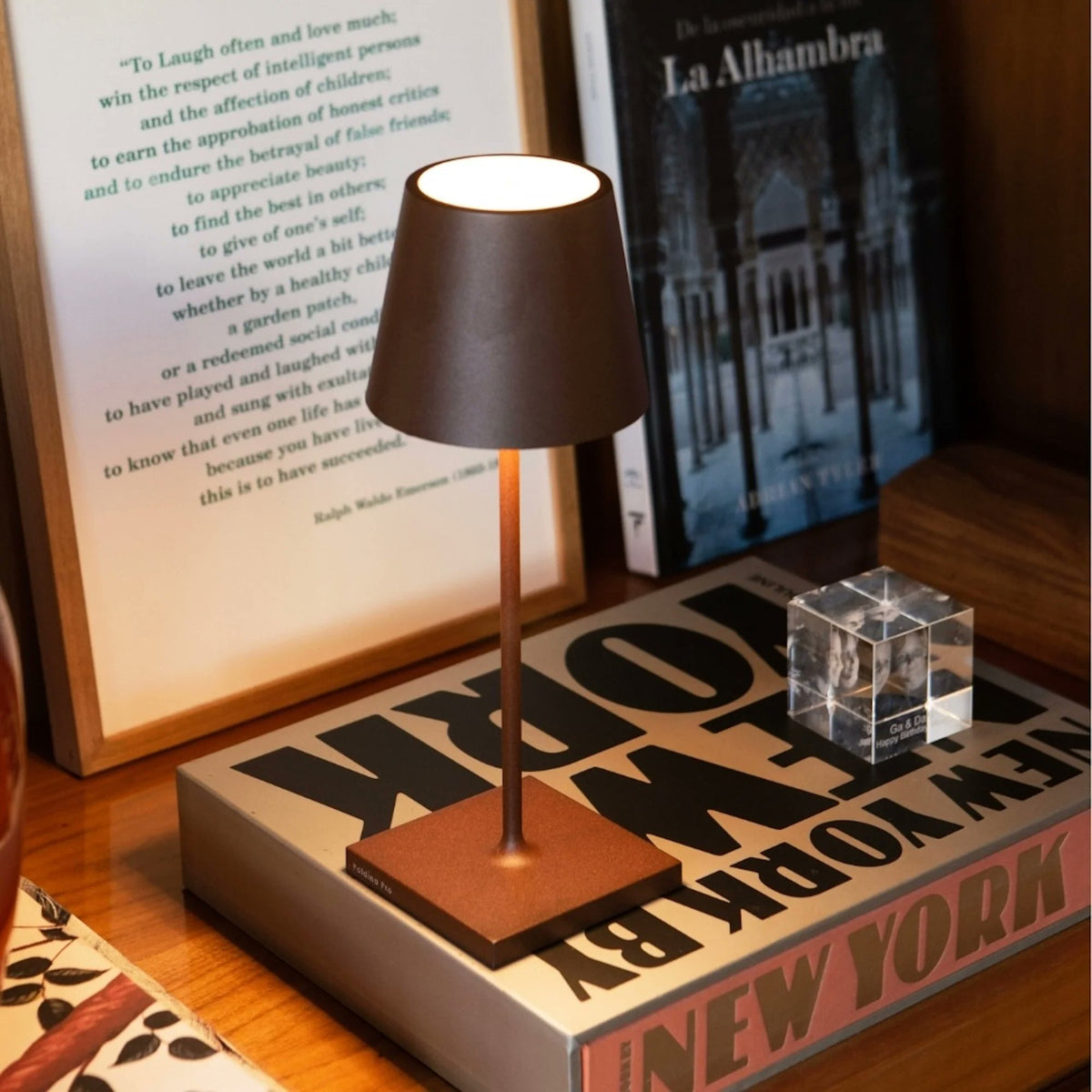 Zafferano Poldina Pro Mini cordless table lamp four color options black white chrome rust on white background