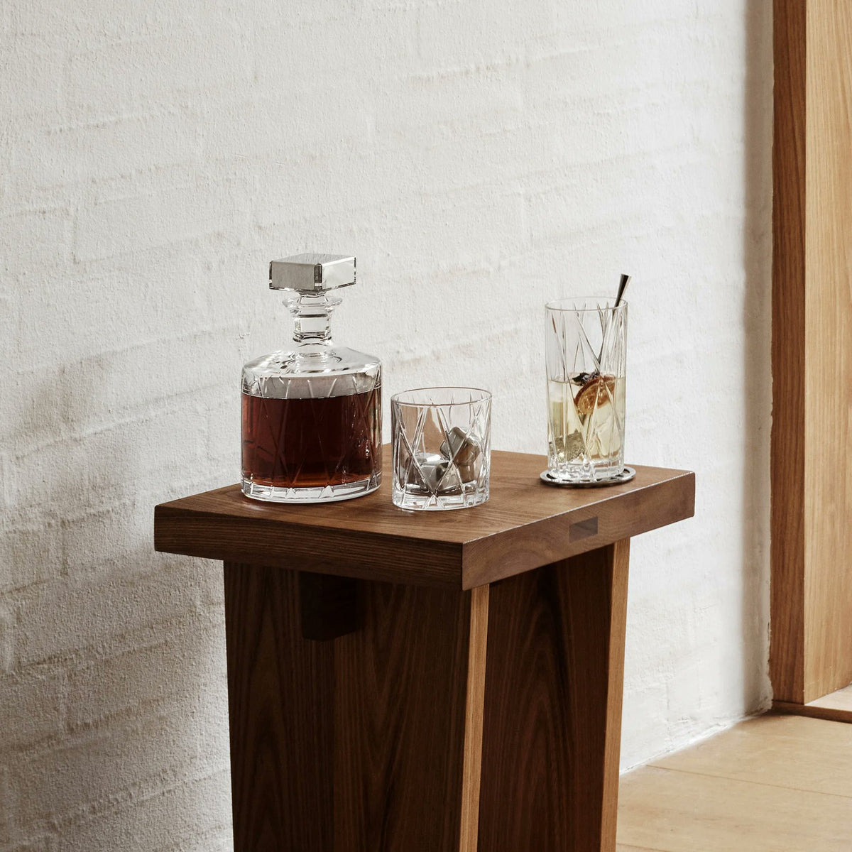 Orrefors City Decanter styled on bar cart with glasses